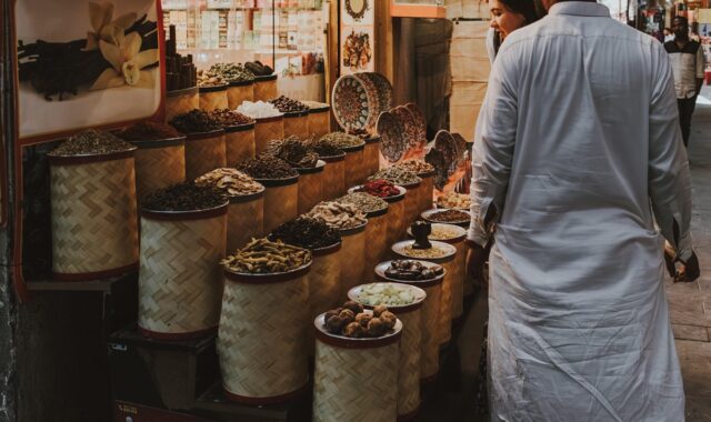 spice market, dubai souq, traditional market, spice stall, middle eastern spices, local shopping, dubai, souq shopping, herbs, aromatic spices, shopping in dubai, cultural experience, market scene, tourists shopping, middle east, bazaar, traditional trade, vanilla pods, dried spices, street market, exotic spices, local market, food market