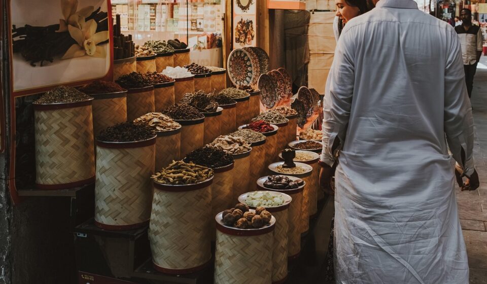 spice market, dubai souq, traditional market, spice stall, middle eastern spices, local shopping, dubai, souq shopping, herbs, aromatic spices, shopping in dubai, cultural experience, market scene, tourists shopping, middle east, bazaar, traditional trade, vanilla pods, dried spices, street market, exotic spices, local market, food market