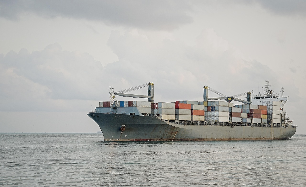 a cargo ship, ship, cargo, transportation, container, export, trade, freight, shipping, industry, logistics, delivery, import, transport, nature, vessel, sea, boat, storage, navigation, gray boat, gray industry